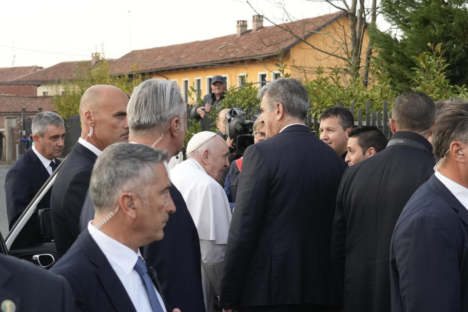 Pope Francis greets faithful upon his arrival in San Carlo, near Asti, Italy, Saturday, Nov. 19, 2022. The Pontiff returned to his father's birthplace in northern Italy on Saturday for the first time since ascending the papacy to celebrate the 90th birthday of a second cousin who long knew him as simply "Giorgio." (AP Photo/Gregorio Borgia)