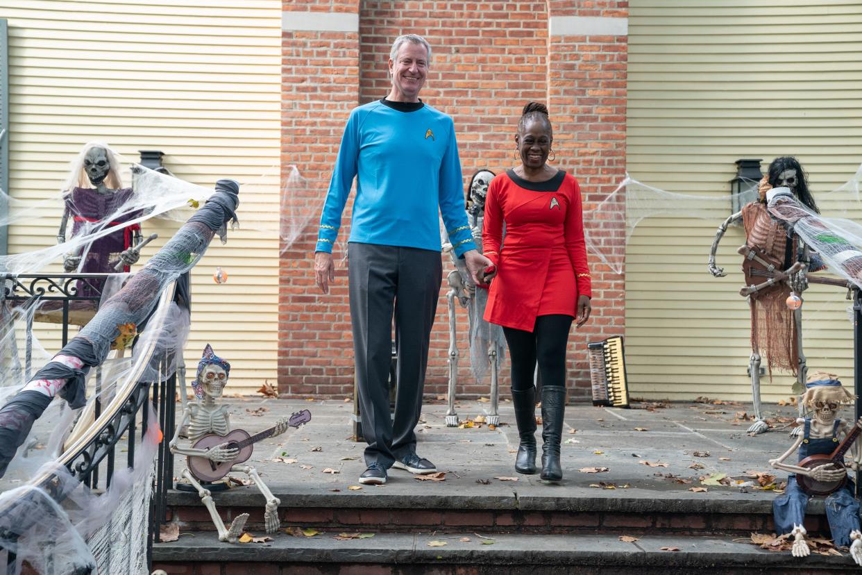 Then-New York City Mayor Bill de Blasio and First Lady Chirlane McCray reveal their costumes during Halloween at Gracie Mansion in Manhattan, New York on Saturday, Oct. 30, 2021.