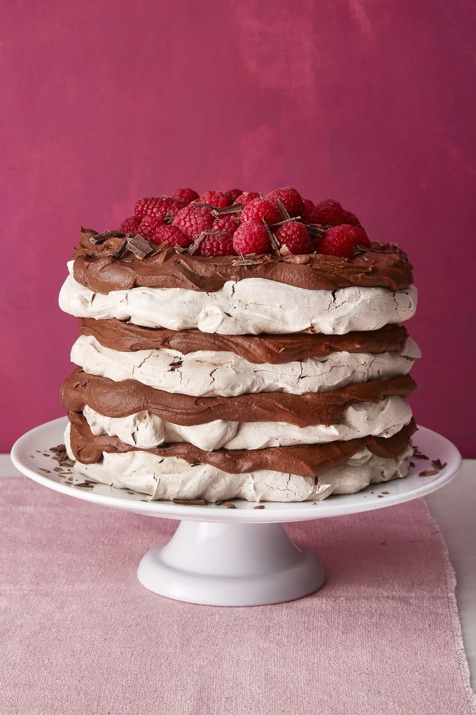 chocolate meringue layer cake with raspberries on top