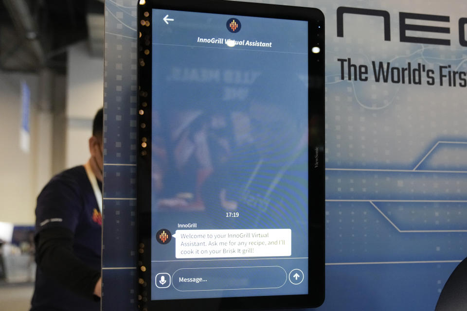 The InnoGrill Virtual Assistant AI is displayed next to the NeoSear smart grill by BriskIt during the CES tech show Wednesday, Jan. 10, 2024, in Las Vegas. (AP Photo/Ryan Sun)