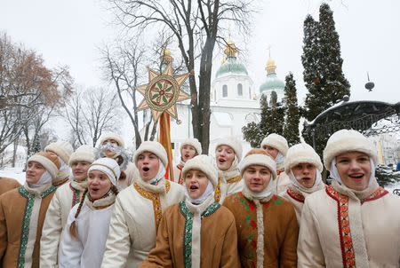 Performers sing Christmas carols after a service marking Orthodox Christmas and celebrating the independence of the Orthodox Church of Ukraine in Kiev, Ukraine January 7, 2019. REUTERS/Valentyn Ogirenko