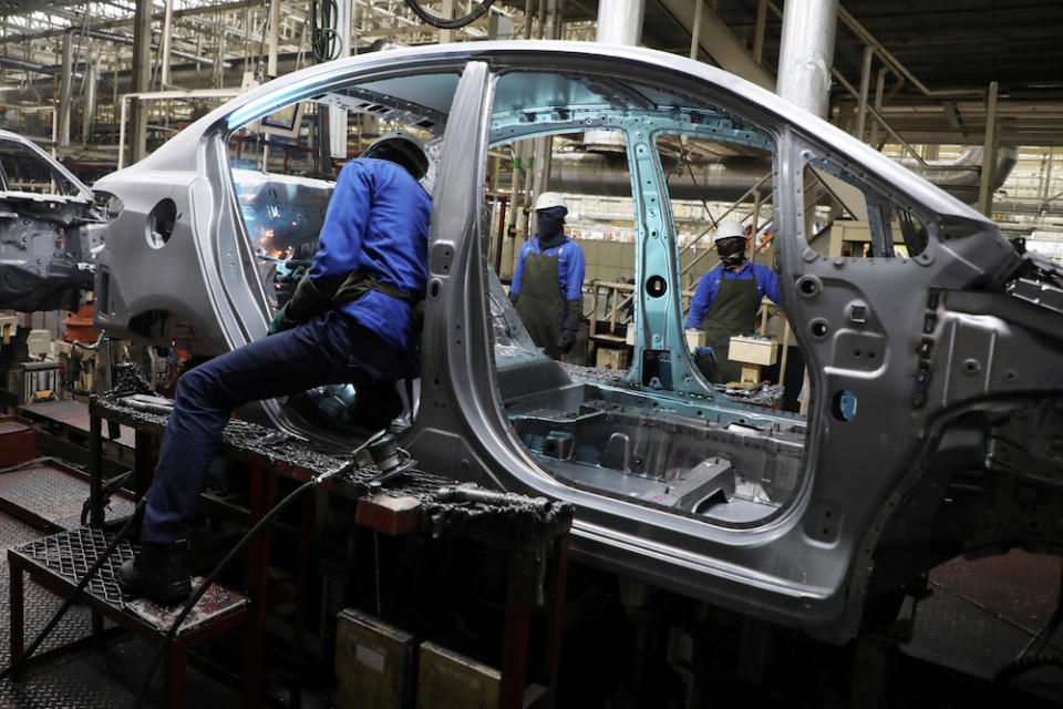 Employees work at an assembly line in the Proton manufacturing plant in Tanjung Malim December 16, 2019. — Reuters pic