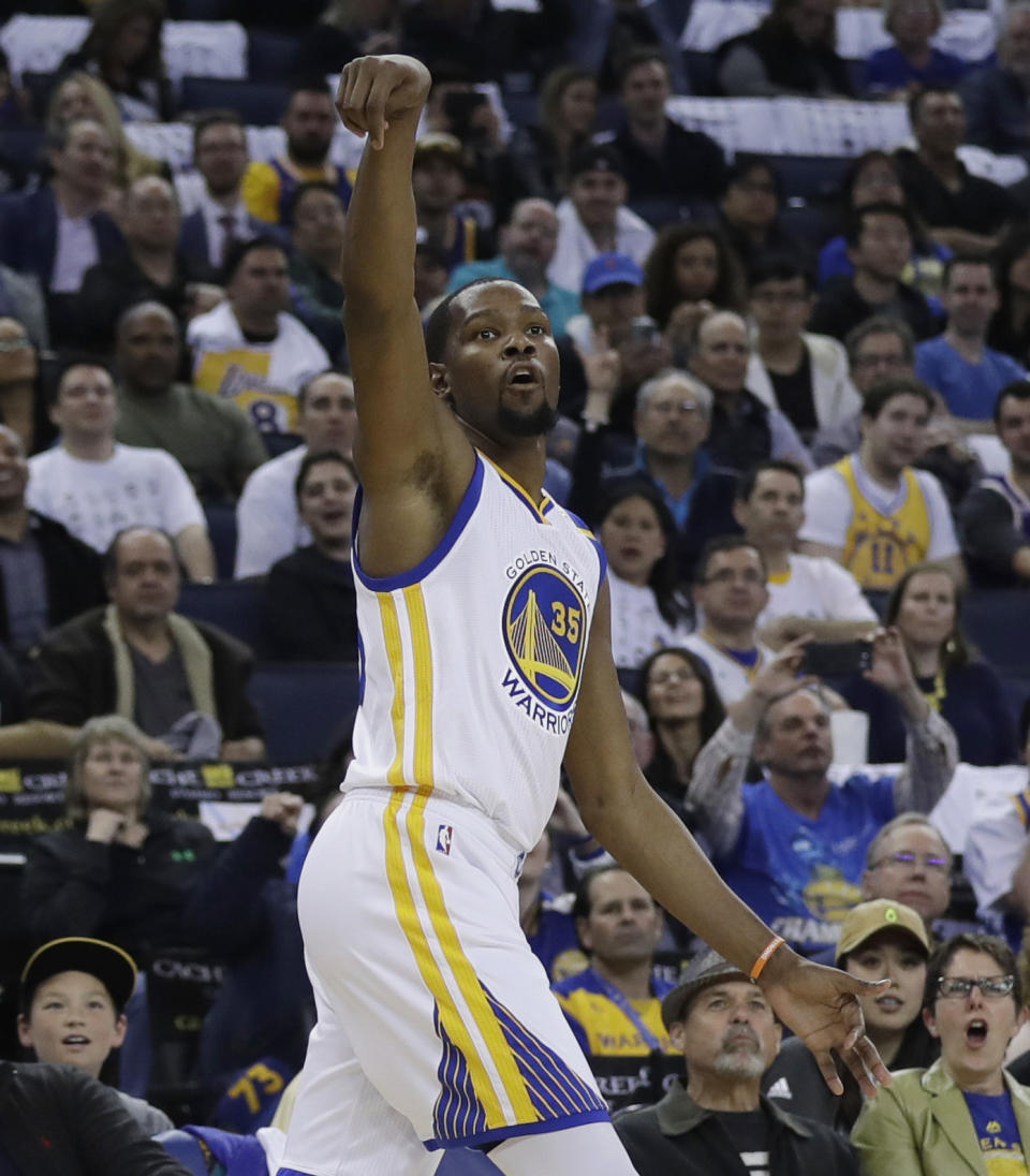 FILE - In this April 12, 2017, file photo, Golden State Warriors' Kevin Durant follows through on a 3-point basket during the second half of the team's NBA basketball game against the Los Angeles Lakers, in Oakland, Calif. Nobody wanted to miss this impromptu, incredible shooting display by two of the world's very best: Stephen Curry and Kevin Durant took turns firing 3-pointer after 3-pointer, some 200 of them total, all while their coaches-turned-rebounders kept careful count of their makes and misses in an entertaining post-practice show.(AP Photo/Marcio Jose Sanchez)