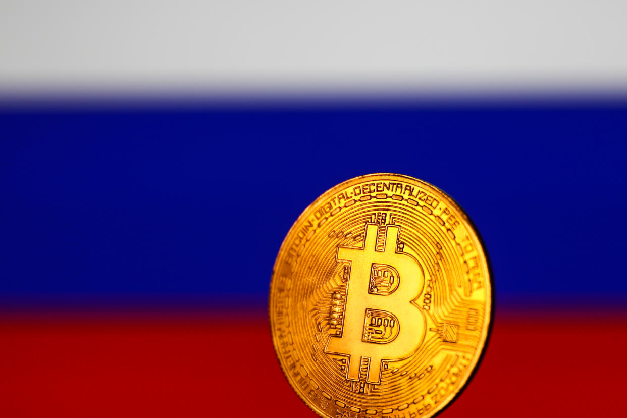 Representation of Bitcoin and Russian flag 