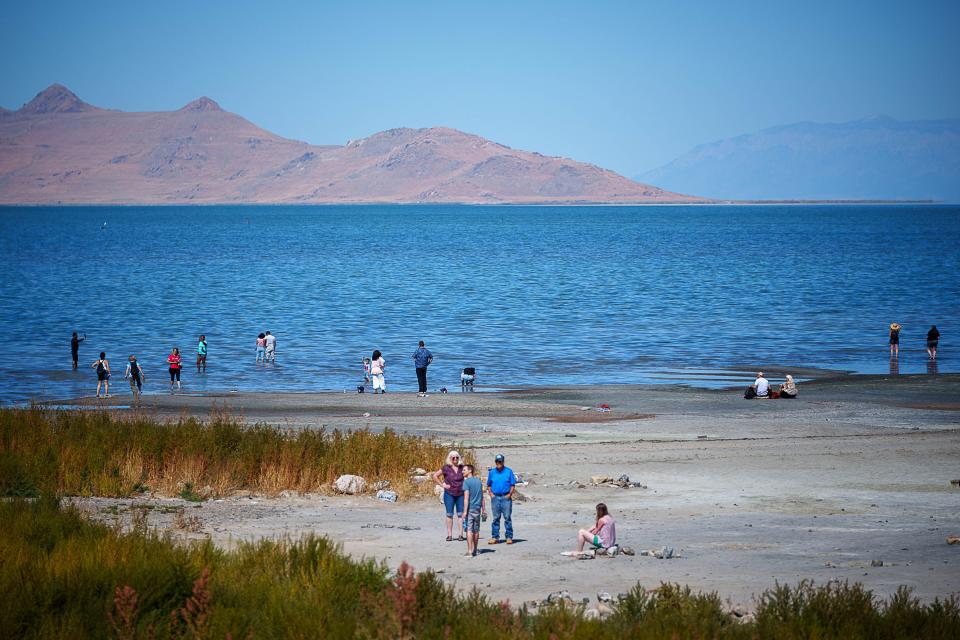 People on the shore of the Great Salt Lake on Saturday, Sept. 16, 2023. | Trent Nelson, The Salt Lake Tribune