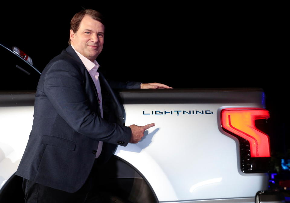 Ford CEO Jim Farley poses with the Ford F-150 Lightning pickup truck in Dearborn, Michigan, U.S., May 19, 2021.  Picture taken May 19, 2021. REUTERS/Rebecca Cook