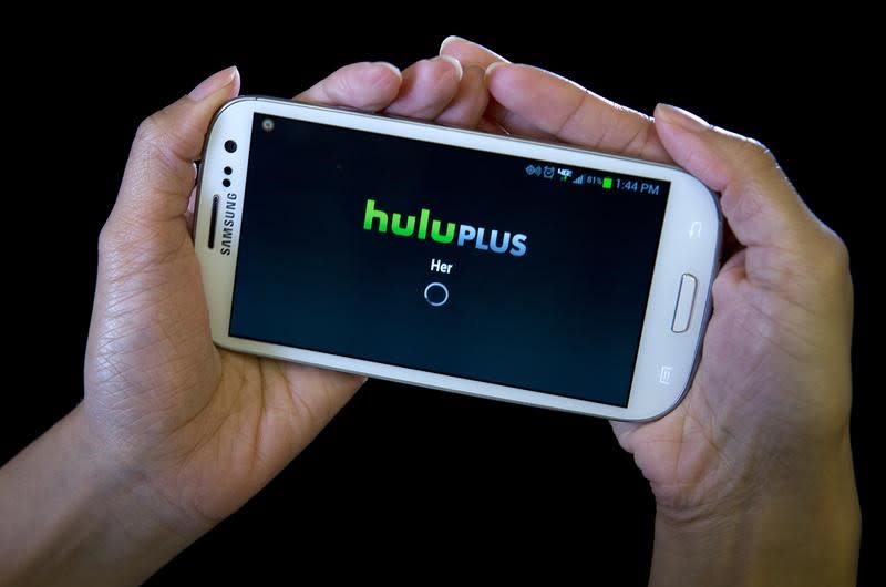 The HULU Plus app is played on a Samsung Galaxy phone in this photo-illustration in New York, December 23, 2013. REUTERS/Carlo Allegri