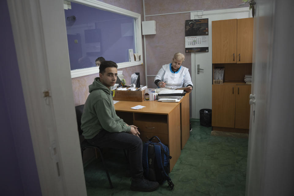 A recruit passes medical examination in a city hospital in Kyiv, Ukraine, Thursday, Feb. 8, 2024. As the third year of war begins, the most sensitive and urgent challenge pressing on Ukraine is whether it can muster enough new soldiers to repel – and eventually drive out – an enemy with far more fighters at its disposal. (AP Photo/Efrem Lukatsky)