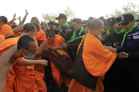 Dhammakaya temple Buddhist monks scuffle with police after they defied police orders to leave the temple grounds to enable police to seek out their former abbot in Pathum Thani, Thailand February 20, 2017. REUTERS/Stringer