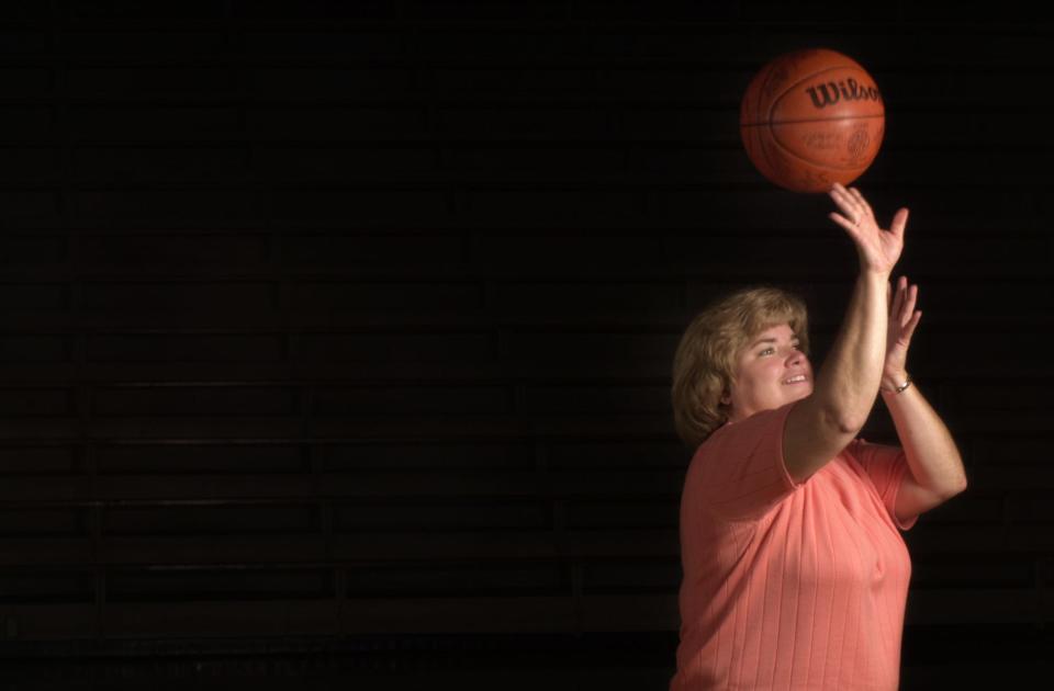 Judi Warren was Indiana's first Miss Basketball in 1976.  She poses in the Carmel High School gym in 2002.