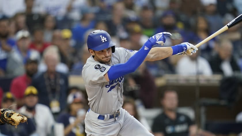 Los Angeles Dodgers' Trea Turner bats during the first inning of a baseball game against the San Diego Padres.