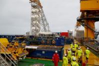 FILE PHOTO: People walk on the Equinor's Johan Sverdrup oilfield platform in the North Sea