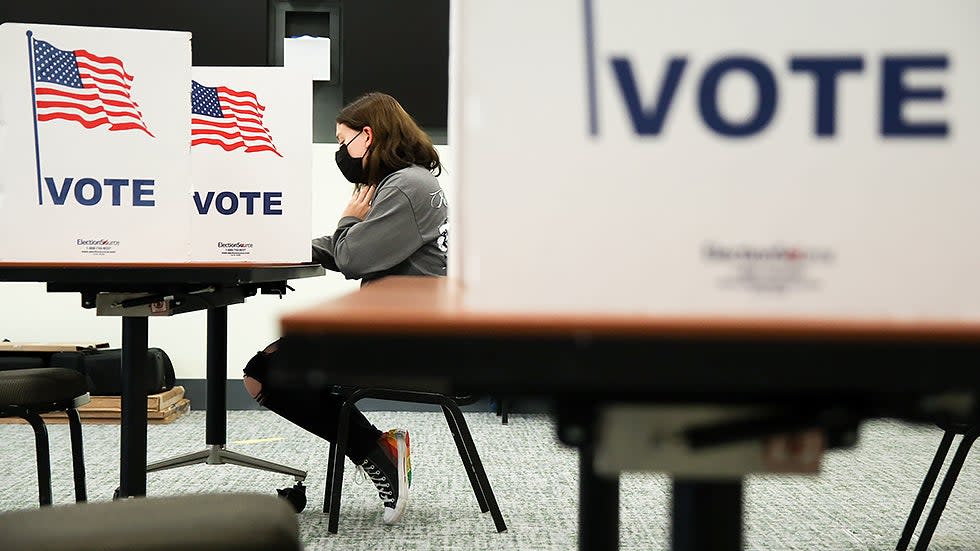 A George Mason University student votes in Fairfax, Va., on Tuesday, November 2, 2021.