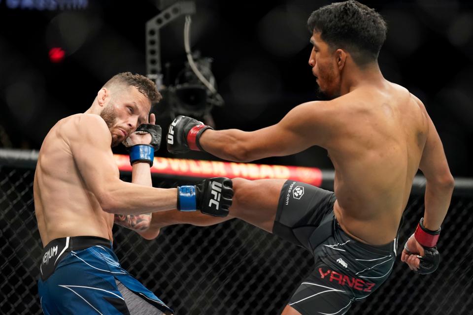 Houston bantamweight Adrian Yanez, right, lands a front kick en route to a first-round stoppage of Shreveport's Tony Kelley at Austin Fight Night at Moody Center on Saturday. A sellout crowd of 13.,689 attended, the most for a non-pay-per-view UFC event.