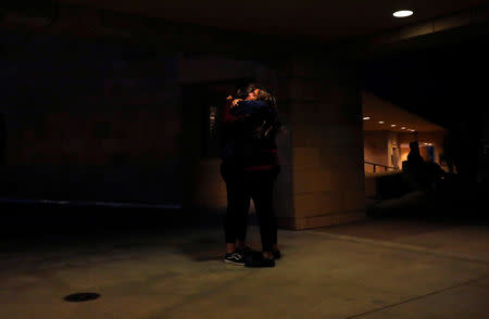 Savanna Cory and Jennifer Quinteros embrace after a vigil for families of victims of a mass shooting in Thousand Oaks, California, U.S. November 8, 2018. REUTERS/Eric Thayer