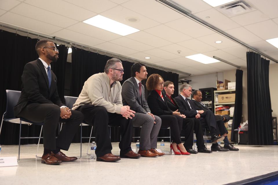 Seven candidates for Akron mayor participate in a debate hosted by the Yours and Mine Akron United Communities Civics Watch Association at Robinson Community Learning Center on March 9.