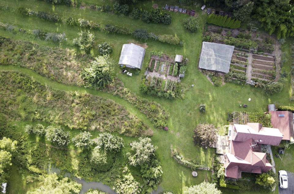 This undated photo shows the garden of writer Lee Reich in New Paltz, NY. A mixed garden of vegetables, flowers, herbs and fruits can please all the senses. (Lee Reich via AP)