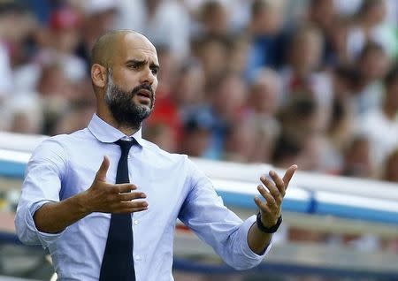 Bayern Munich's coach Pep Guardiola reacts during their German cup (DFB Pokal) first round soccer match against fifth division club FC Noettingen in Karlsruhe, August 9, 2015. REUTERS/Kai Pfaffenbach