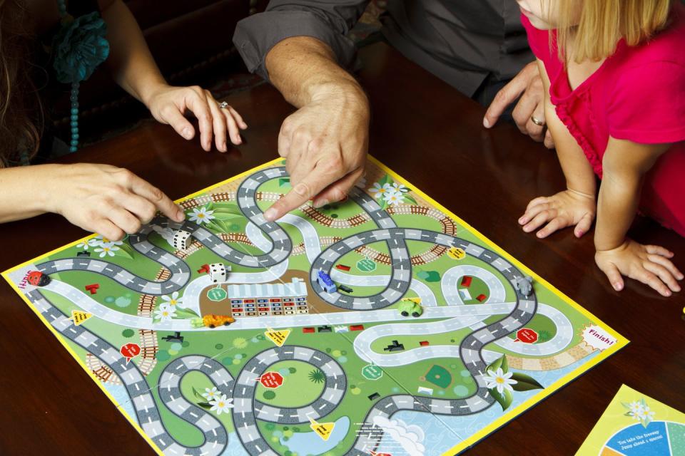 family playing board game