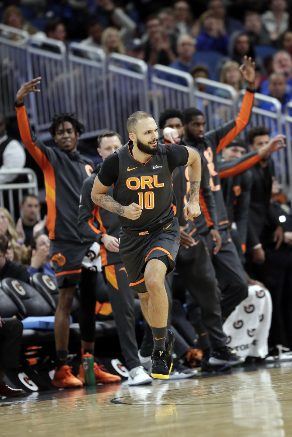 Orlando Magic players on the bench cheer as guard Evan Fournier (10) runs downcourt after sinking a 3-point shot against the Washington Wizards during the first half of an NBA basketball game Wednesday, Jan. 8, 2020, in Orlando, Fla. (AP Photo/John Raoux)