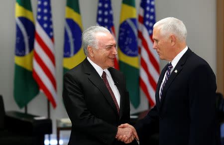 U.S. Vice President Mike Pence is greeted by Brazil's President Michel Temer in Brasilia, Brazil June 26, 2018. REUTES/Adriano Machado