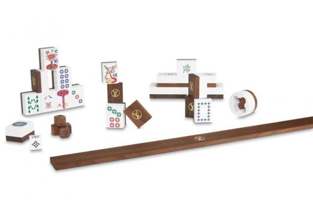 Hand-carved wood & stone mahjong set by Louis Vuitton selling for