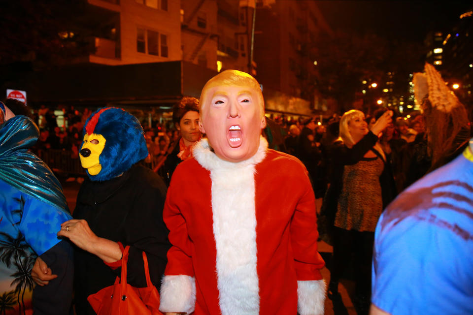 <p>A man wears a Donald Trump mask and a Santa suit at the 44th annual Village Halloween Parade in New York City on Oct. 31, 2017. (Photo: Gordon Donovan/Yahoo News) </p>