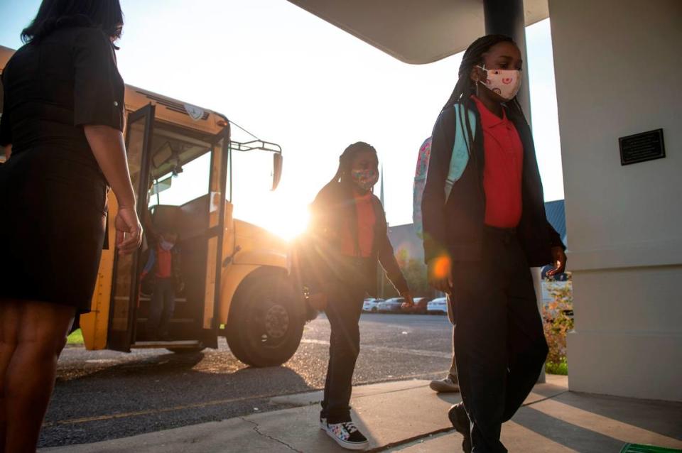 Elementary students arrive off the bus for their first day of the school year at Gautier Elementary School in Gautier on Thursday, Aug. 5, 2021. The school is one of those on the Coast that has seen a jump in COVID-19 cases.