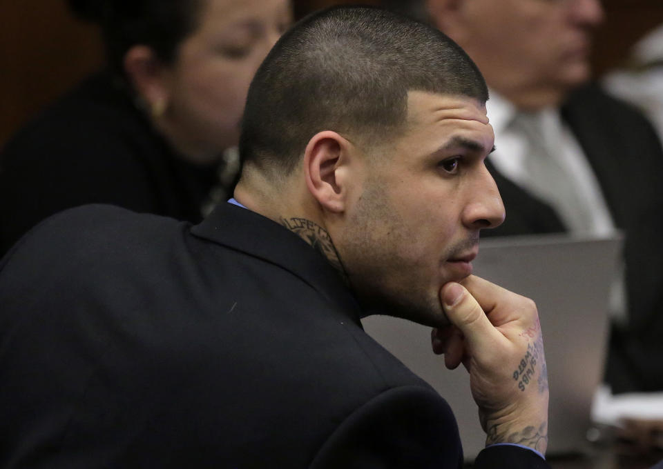 Former New England Patriots tight end Aaron Hernandez is seated during closing arguments in his double murder trial at Suffolk Superior Court, Thursday, April 6, 2017, in Boston. Hernandez is on trial for the July 2012 killings of Daniel de Abreu and Safiro Furtado who he encountered in a Boston nightclub. The former NFL player is already serving a life sentence in the 2013 killing of semi-professional football player Odin Lloyd. (AP Photo/Steven Senne, Pool)