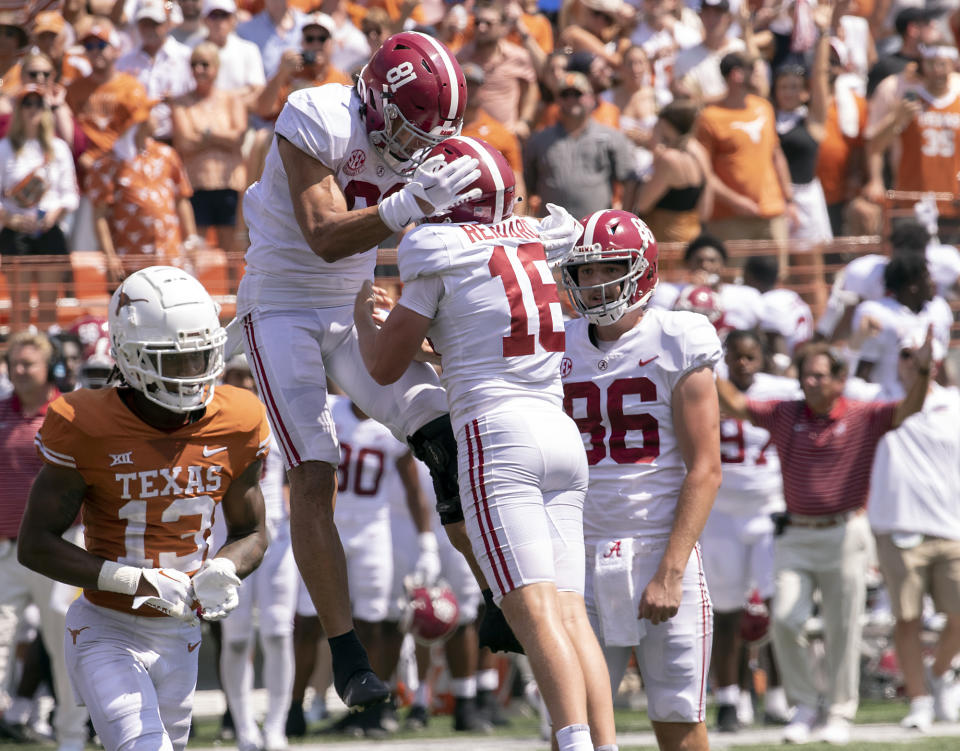 Alabama tight end Cameron Latu (81) celebrates with place kicker Will Reichard and James Burnip (86), after Reichard kicked the game winning field goal as Texas defensive back Jaylon Guilbeau (13) looks on during the second half of an NCAA college football game, Saturday, Sept. 10, 2022, in Austin, Texas. Alabama defeated Texas 20-19. (AP Photo/Rodolfo Gonzalez)