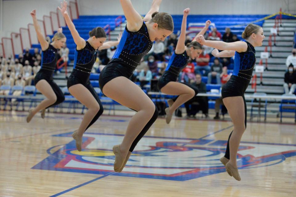 A number of ROCORI dancers jump in the air during its jazz routine at the Central Lakes Conference dance meet at Apollo High School on Friday, Dec. 3, 2021.