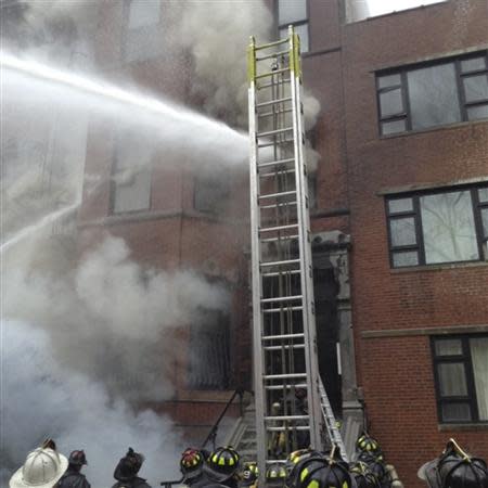 Firefighters battle a nine-alarm blaze in Boston's Back Bay neighborhood March 26, 2014. REUTERS/Boston Fire Department