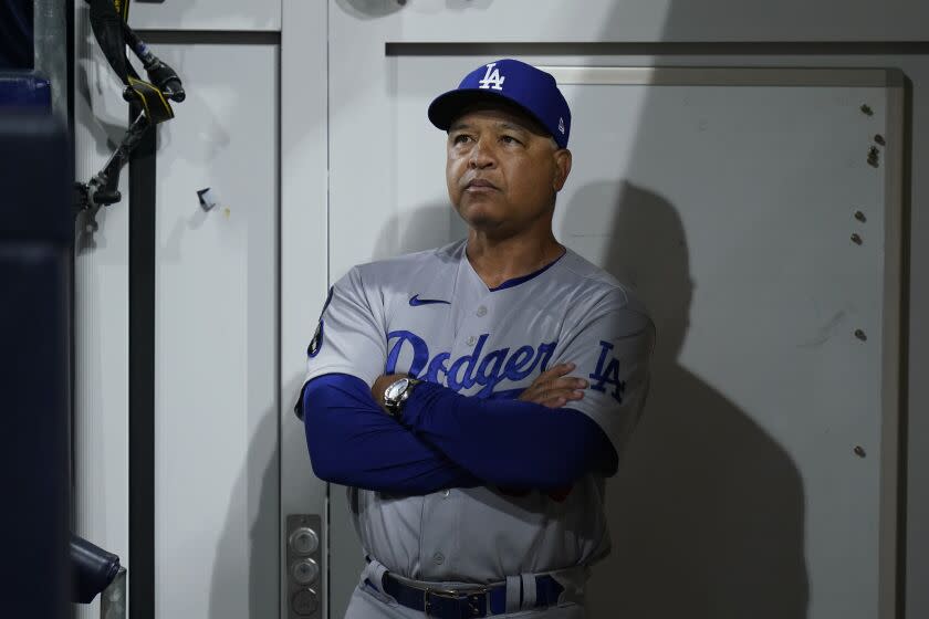 Los Angeles Dodgers manager Dave Roberts looks on before Game 4 of a baseball NL Division Series against the San Diego Padres, Saturday, Oct. 15, 2022, in San Diego. (AP Photo/Jae C. Hong)