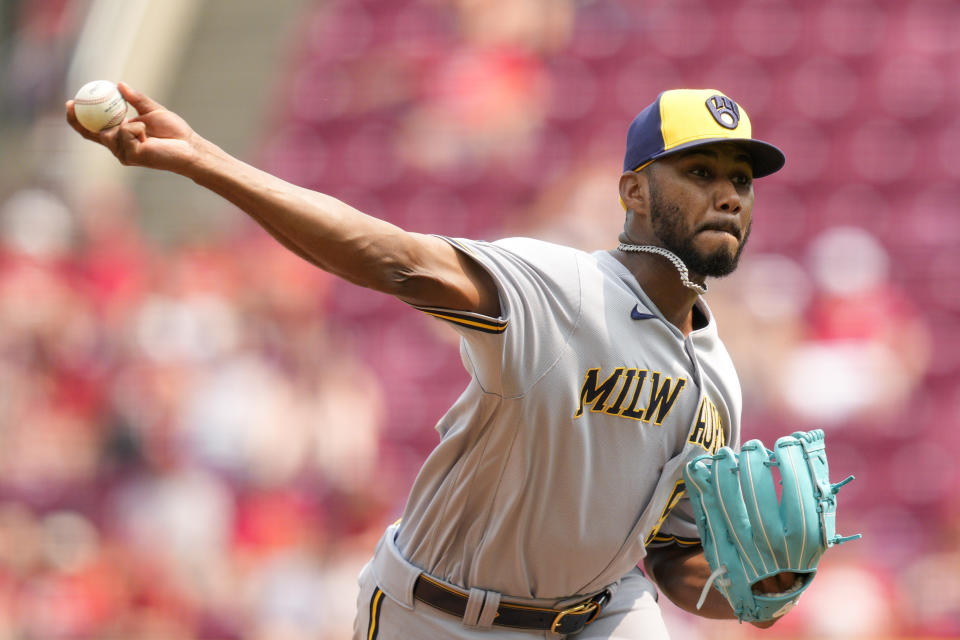 Milwaukee Brewers relief pitcher Elvis Peguero throws against the Milwaukee Brewers in the eighth inning of a baseball game in Cincinnati, Sunday, June 4, 2023. (AP Photo/Jeff Dean)