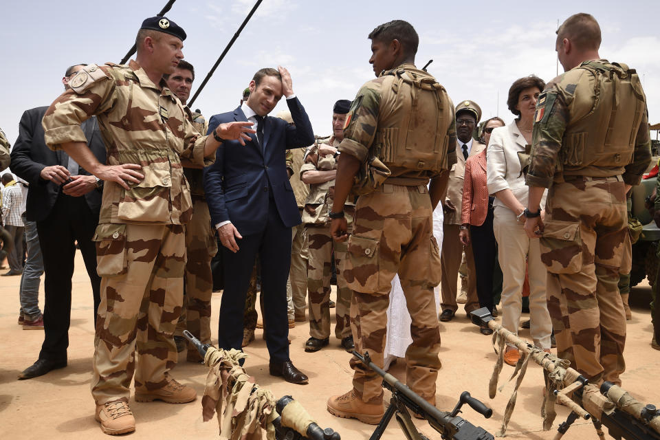 FILE - French President Emmanuel Macron, center left, visits soldiers of Operation Barkhane, France's largest overseas military operation, in Gao, Northern Mali on May 19, 2017. High-stakes legislative elections this Sunday will almost certainly impact the French leader's sway in the fields of defense and foreign affairs, quite possibly diminishing his role as an energetic and influential figure in European and world affairs and as one of Ukraine's primary backers in the war against Russia, say retired French military officers and analysts of France's defense and foreign policies. (Christophe Petit Tesson, Pool via AP, File)