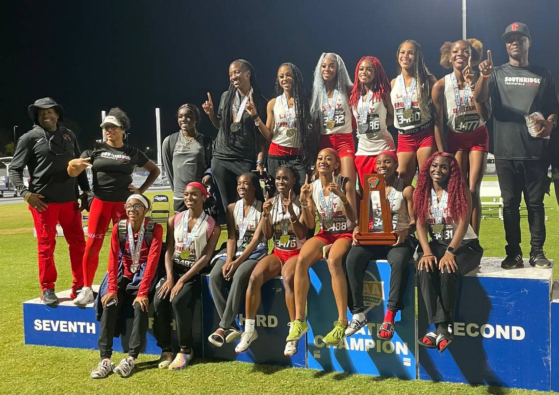Miami Southridge’s girls’ track and field athletes and coaches celebrate after winning the Class 4A state championship on Saturday night at the University of North Florida in Jacksonville, Fla.