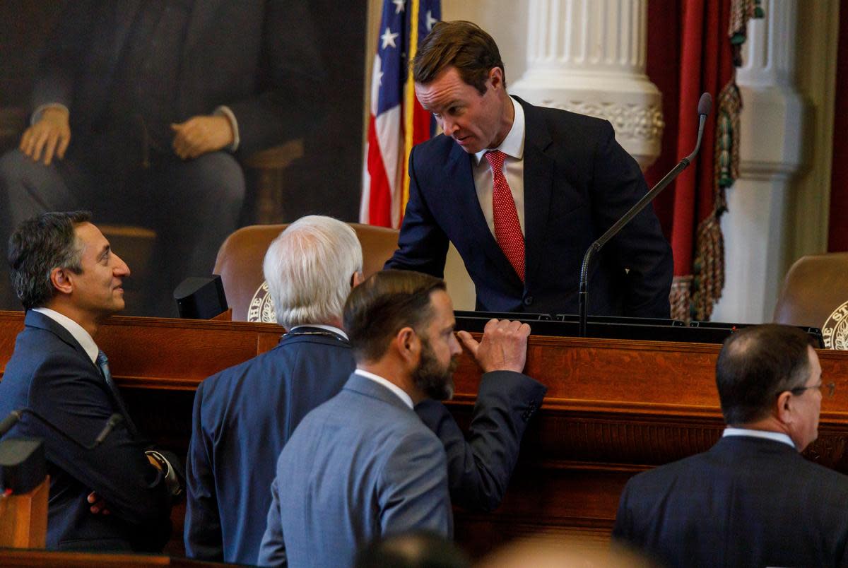 House Speaker Dade Phelan speaks with other representatives during a special legislative session at the state capitol in Austin on Nov. 17, 2023.
