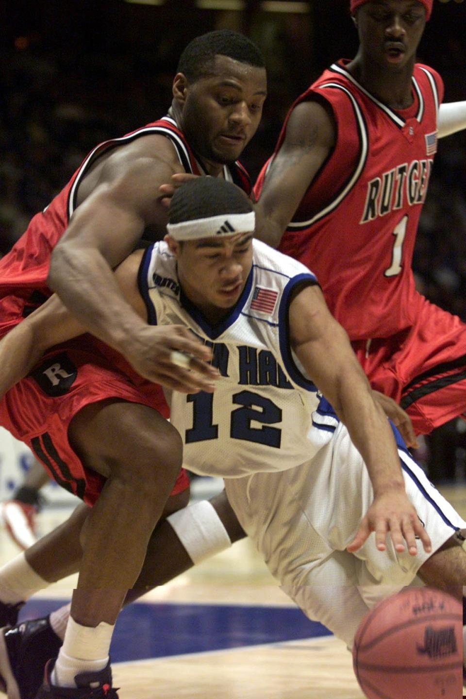 Seton Hall's Andre Barrett is pressured by Rutgers' Rashod Kent.