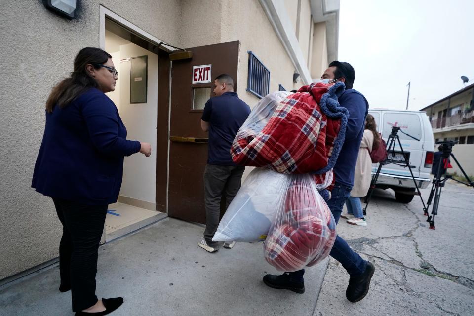 Official bring new blankets into St. Anthony's Croatian Catholic Church in Los Angeles on Wednesday, June 14, 2023. Forty-two migrants, including some children, were dropped off at Union Station Wednesday and were being cared for at the church.