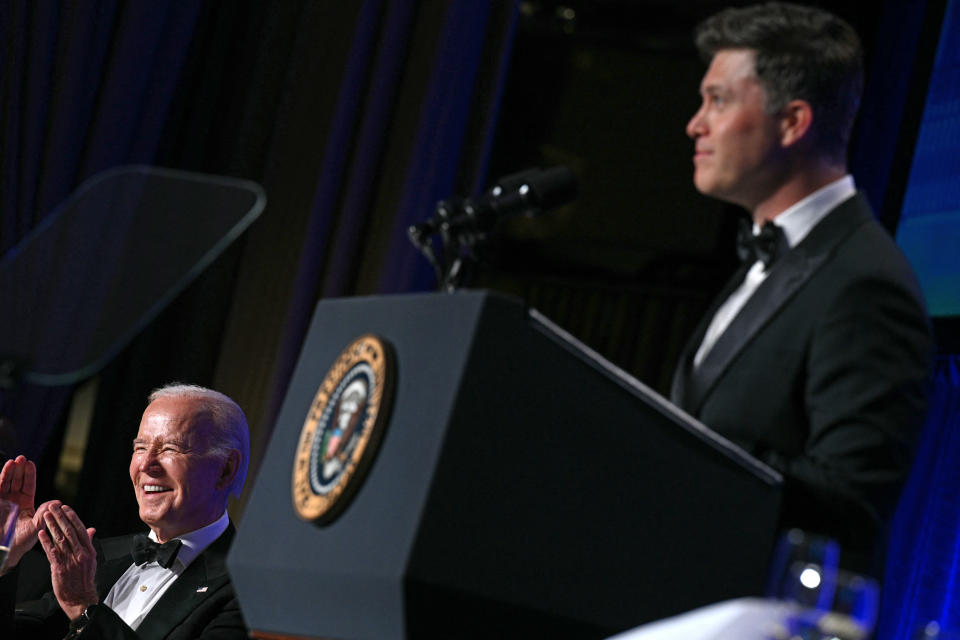 Joe Biden laughs at Colin Jost as he entertains at the White House Correspondents’ Association dinner.