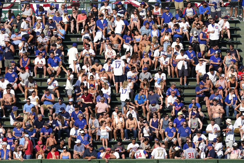 Fans wait for a baseball game between the St. Louis Cardinals and the Chicago Cubs in Chicago, Saturday, June 12, 2021. (AP Photo/Nam Y. Huh)