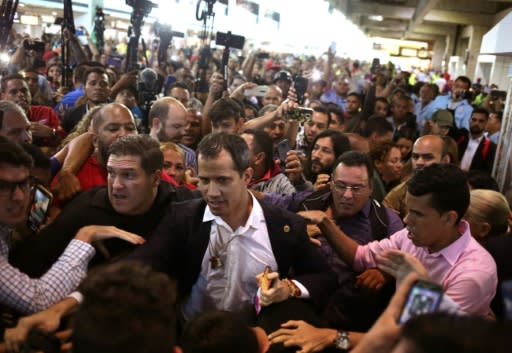 Juan Guaido received a mixed reception at the Caracas international airport on February 11 with some Maduro supporters calling him a 'fascist' and 'traitor'