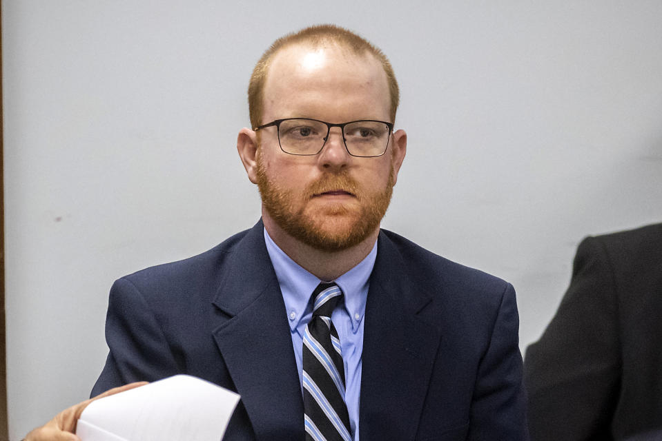 Travis McMichael listens to attorneys question a pool of prospective jurors during jury selection for the trial of he and his father Greg McMichael and William "Roddie" Bryan, at the Glynn County Courthouse, Monday, Oct. 25, 2021, in Brunswick, Ga. The trio are charged with the slaying of 25-year-old Ahmaud Arbery in February 2020. (AP Photo/Stephen B. Morton, Pool)