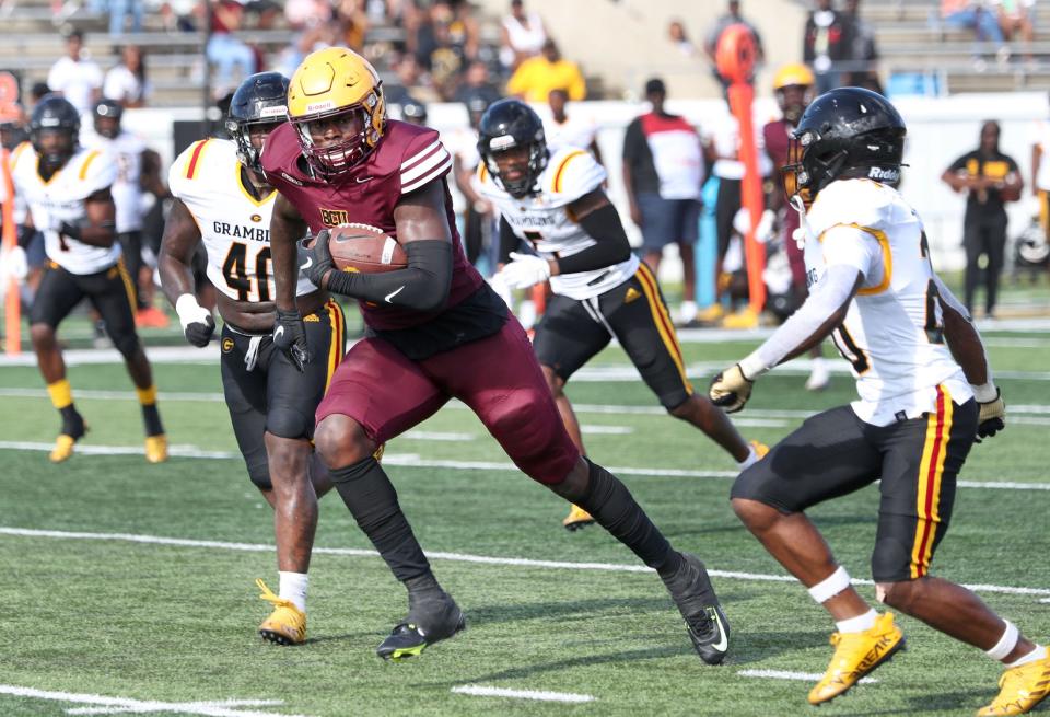 Bethune-Cookman tight end Kemari Averett (1) rumbles down the field Saturday Sept. 24, 2022, as Grambling State defenders give chase at Daytona Stadium.