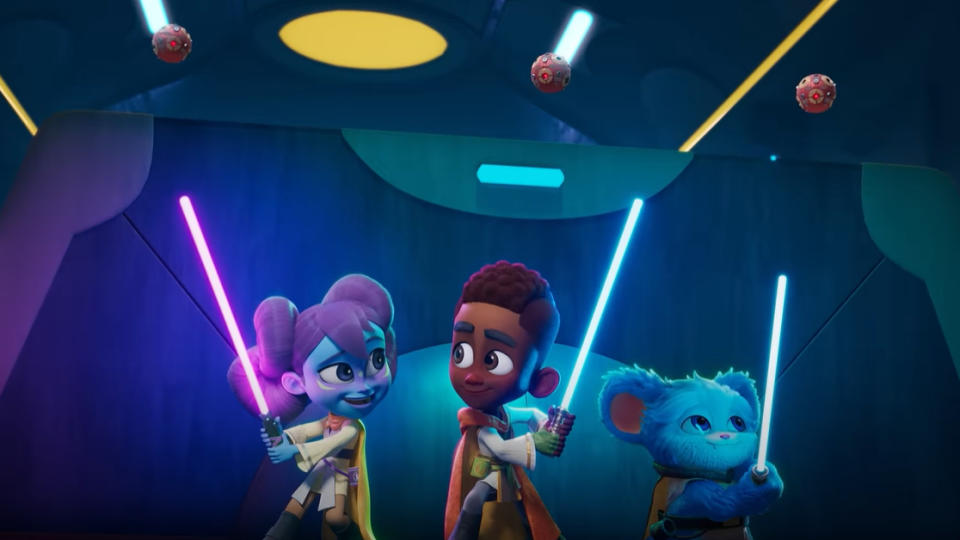 Animated characters holding lightsabers, appearing as playful young Jedi, with robots overhead