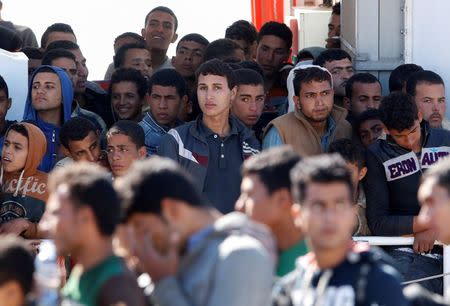 Migrants disembark from the Italian coastguard vessel Peluso in the Sicilian harbour of Augusta, Italy, May 13, 2016. REUTERS/Antonio Parrinello