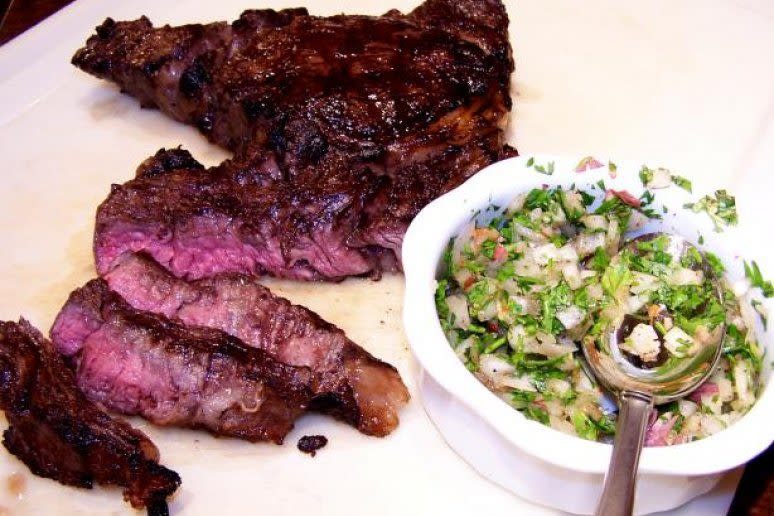 <p>More churrasco! This time we present churrasco in the style of São Paulo, one of Brazil’s great cities. This simple recipe requires an overnight marinade of lemon juice and is then accompanied by a traditional Brazilian chimichurri made with onion, lemon, red pepper, and cilantro.</p><p><strong><a rel="nofollow noopener" href="http://www.thedailymeal.com/recipes/paulista-churrasco-recipe?referrer=yahoo&category=beauty_food&include_utm=1&utm_medium=referral&utm_source=yahoo&utm_campaign=feed" target="_blank" data-ylk="slk:For this churrasco recipe, click here.;elm:context_link;itc:0;sec:content-canvas" class="link ">For this churrasco recipe, click here.</a></strong></p>