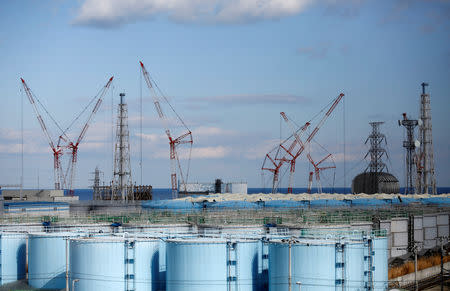 The reactor units No.1 to 4 are seen over storage tanks for radioactive water at Tokyo Electric Power Co's (TEPCO) tsunami-crippled Fukushima Daiichi nuclear power plant in Okuma town, Fukushima prefecture, Japan February 18, 2019. Picture taken February 18, 2019. REUTERS/Issei Kato