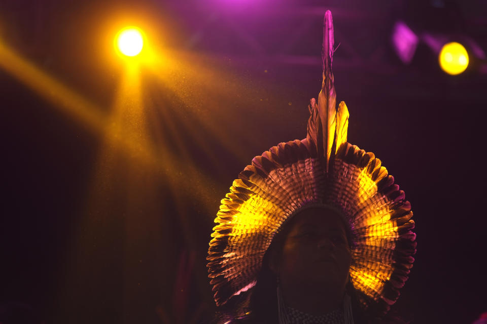 An Indigenous model wears a creation from Indigenous designers during a fashion event, as part of the Third March of Indigenous Women, to claim women's rights and the demarcation of Indigenous lands, in Brasilia, Brazil, Tuesday, Sept. 12, 2023. (AP Photo/Eraldo Peres)