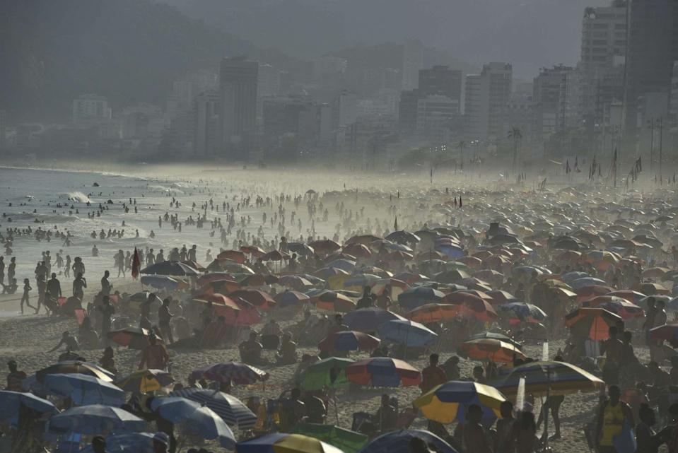 PHOTO: People refresh themselves on the Ipanema beach, as temperatures soar is in the middle of the winter season in Rio De Janeiro, Brazil, Aug. 23, 2023. (Anadolu Agency via Getty Images)